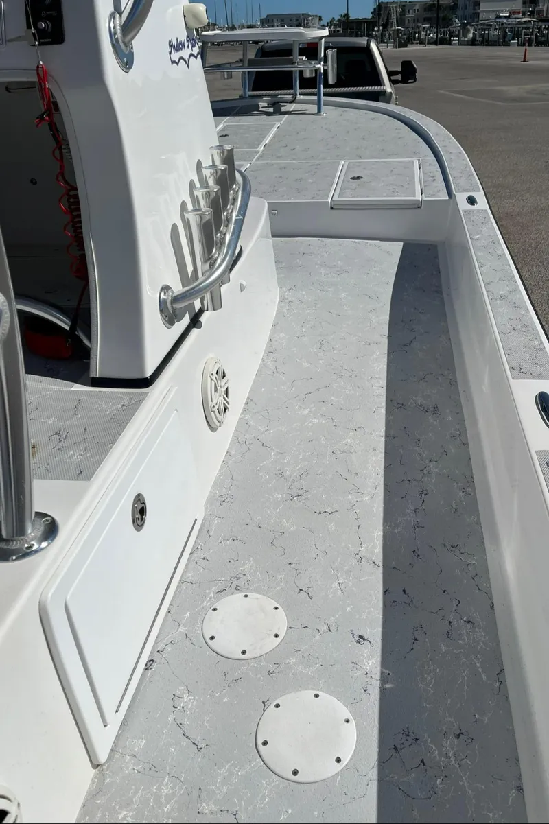 Slide: The Image of 2018 Shallow Sport 25 X3 boat deck with sleek design and modern features. - 11