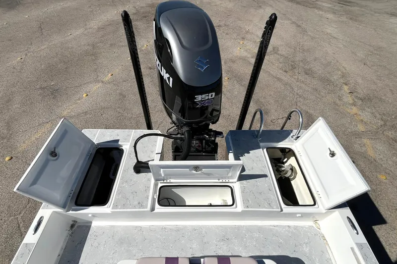 Slide: The Image of 2018 Shallow Sport 25 X3 boat with Suzuki 350 engine, open storage compartments. - 5