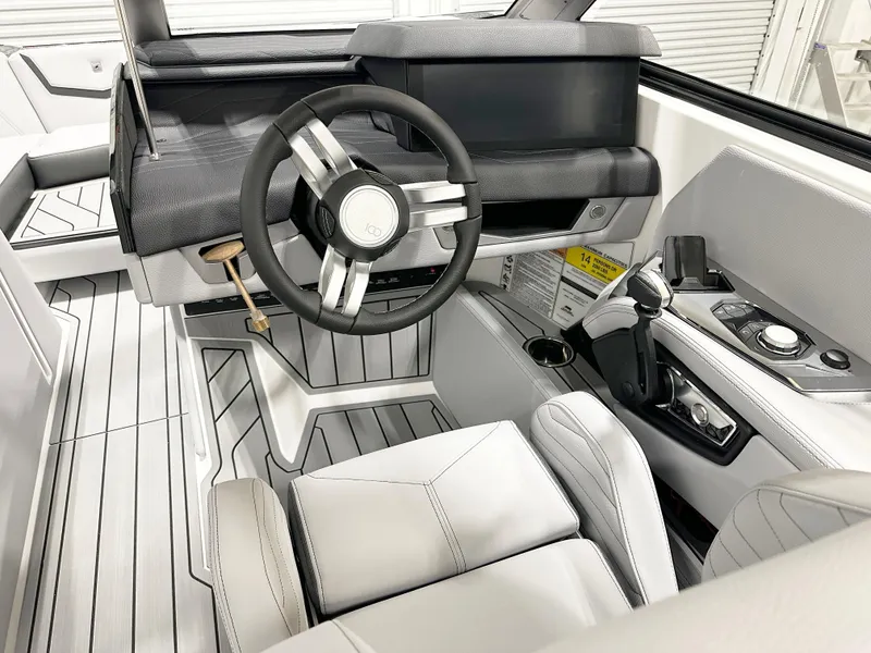 Slide: The Image of 2025 Nautique Super Air Nautique G21 boat in showroom, front view. - 3