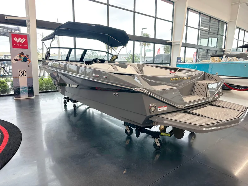 Slide: The Image of 2025 Nautique Ski boat displayed indoors, featuring sleek design and modern features. - 3