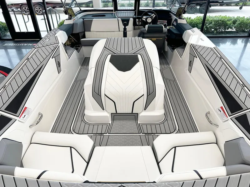 Slide: The Image of 2025 Nautique Ski boat interior with sleek, modern design and comfortable seating. - 7