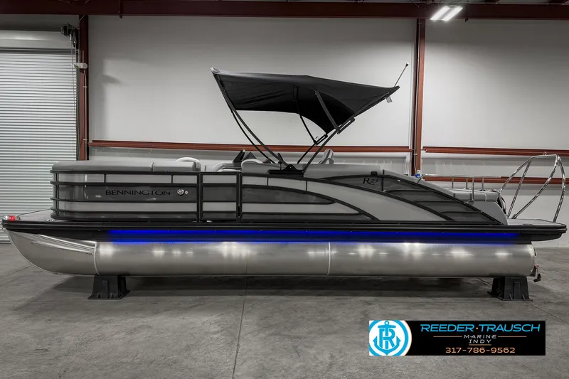 Slide: The Image of 2025 Bennington 23 RSB pontoon boat with canopy in showroom. - 10