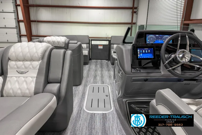 Slide: The Image of Interior of 2025 Bennington 23 RSB boat with luxurious seating and modern dashboard. - 22