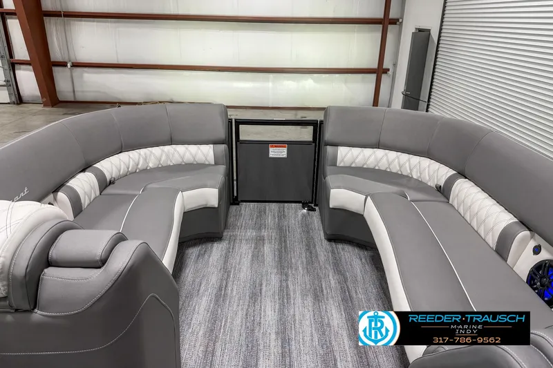Slide: The Image of 2025 Bennington 23 RSB pontoon boat interior with gray seating and carpet. - 24