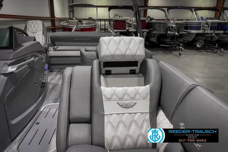Slide: The Image of 2025 Bennington 23 RSB luxury boat interior with diamond-stitched seating in showroom. - 28