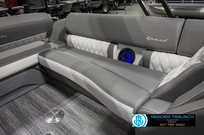 Slide: The Image of 2025 Bennington 23 RSB boat interior with gray seating and blue speaker. - 30