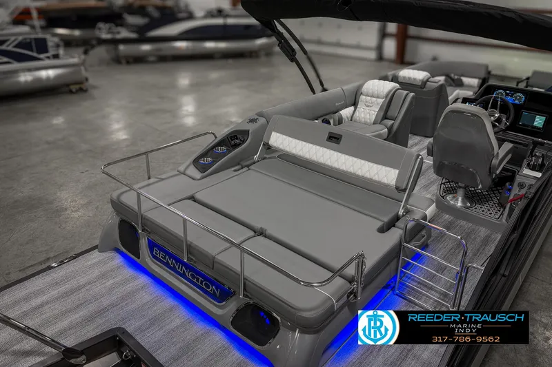 Slide: The Image of 2025 Bennington 23 RSB pontoon boat interior with modern seating and blue LED lighting. - 32
