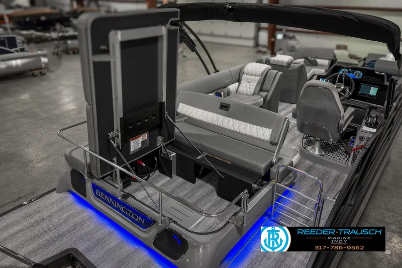 Slide: The Image of 2025 Bennington 23 RSB pontoon boat interior with modern seating and blue LED lighting. - 34