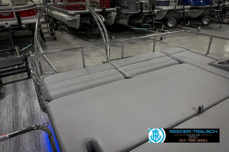Slide: The Image of 2025 Bennington 23 RSB pontoon boat interior with gray seating in showroom. - 35