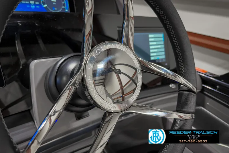 Slide: The Image of Steering wheel of 2025 Bennington 23 RSB boat with digital dashboard display. - 39