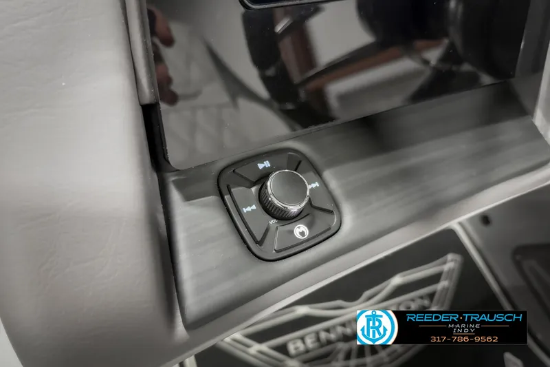 Slide: The Image of Close-up of 2025 Bennington 23 RSB control panel with knob and logo. - 40