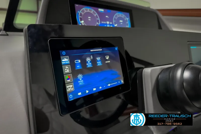 Slide: The Image of 2025 Bennington 23 RSB dashboard with touchscreen controls and digital display. - 41