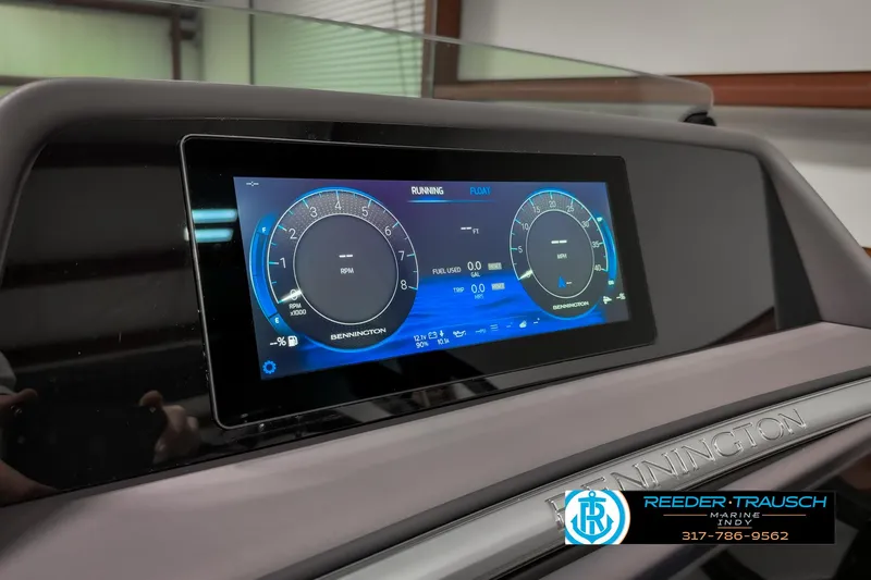 Slide: The Image of 2025 Bennington 23 RSB dashboard display with digital gauges and controls. - 42