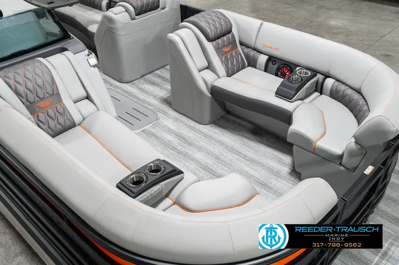 Slide: The Image of 2025 Bennington 23 RSB boat interior with luxurious gray seating and orange accents. - 10