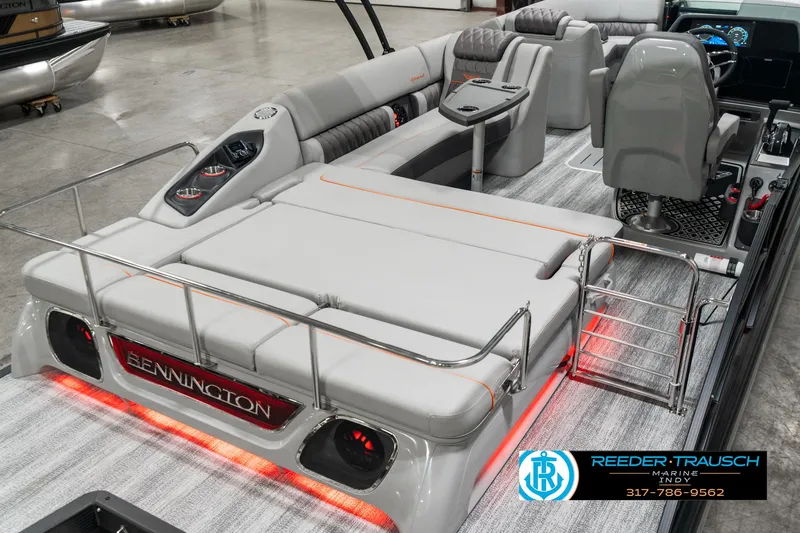 Slide: The Image of 2025 Bennington 23 RSB pontoon boat interior with luxurious seating and ambient lighting. - 11