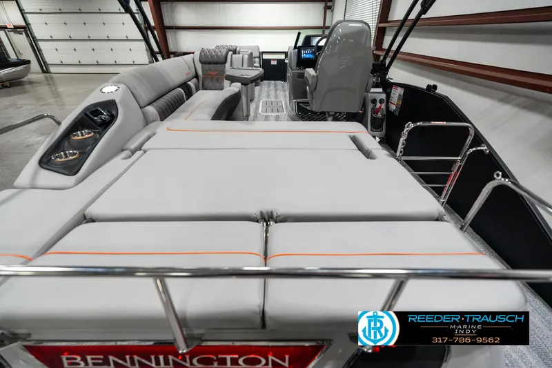 Slide: The Image of 2025 Bennington 23 RSB pontoon boat interior with plush seating and modern controls. - 16