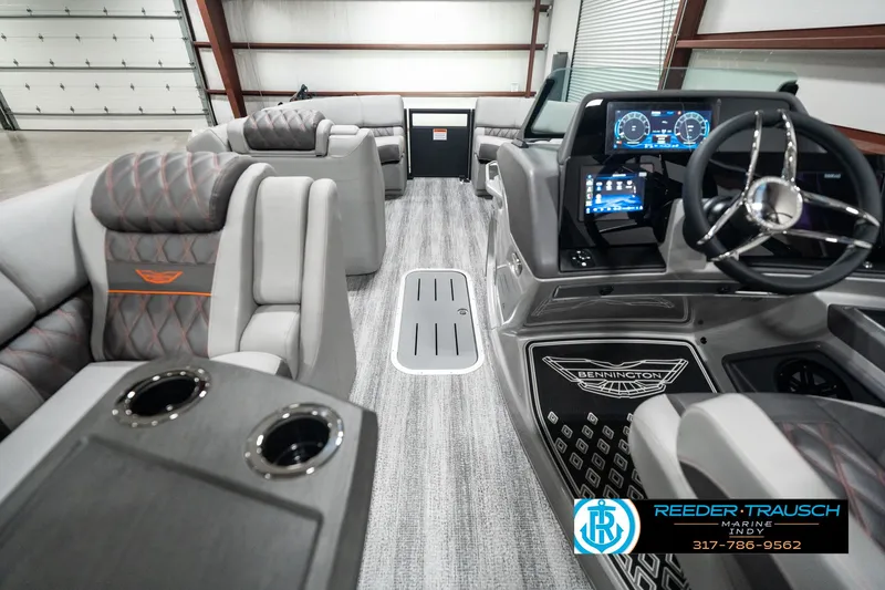 Slide: The Image of 2025 Bennington 23 RSB boat interior with luxurious seating and modern dashboard. - 17