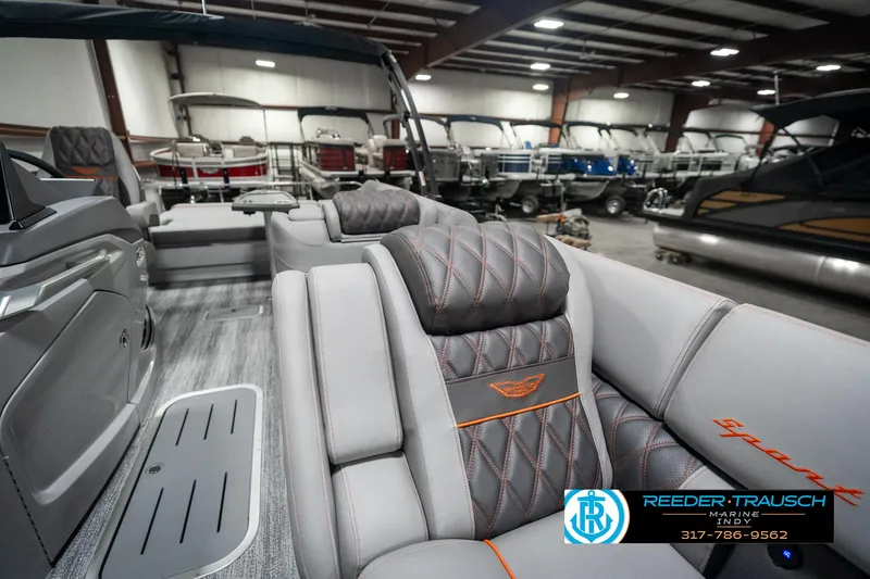 Slide: The Image of Interior of 2025 Bennington 23 RSB boat with luxurious seating in showroom. - 21
