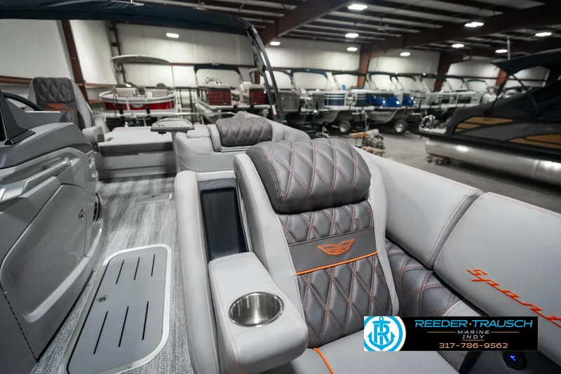 Slide: The Image of 2025 Bennington 23 RSB luxury boat interior with plush seating and modern design. - 24