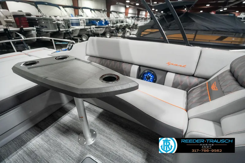 Slide: The Image of 2025 Bennington 23 RSB boat interior with seating and table, showcased at Reeder-Trausch Marine. - 25