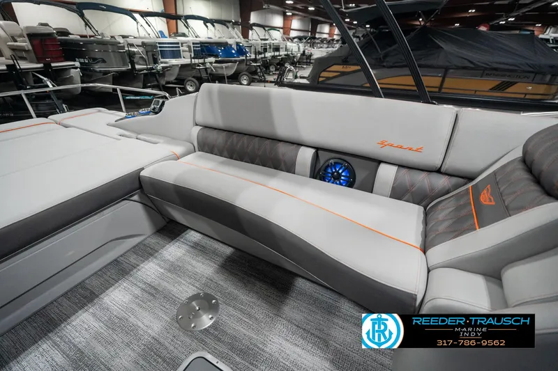 Slide: The Image of 2025 Bennington 23 RSB boat interior with gray seating and blue speaker. - 26