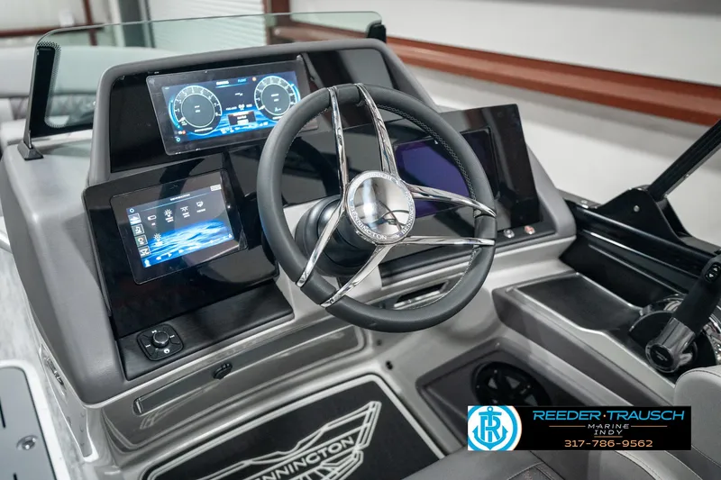 Slide: The Image of 2025 Bennington 23 RSB boat dashboard with modern steering and digital displays. - 36