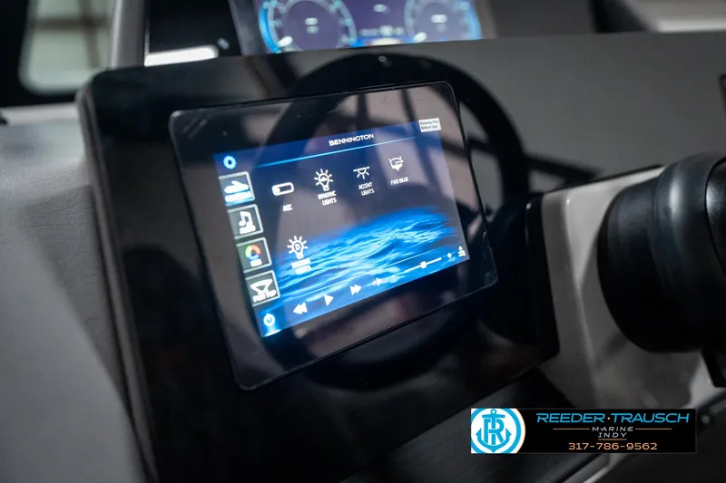 Slide: The Image of 2025 Bennington 23 RSB dashboard with touchscreen display and controls. - 39