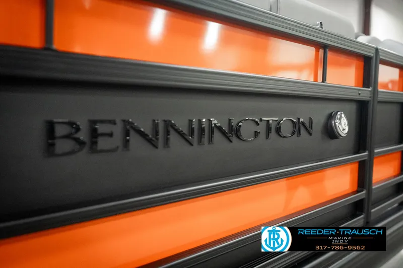 Slide: The Image of 2025 Bennington 23 RSB boat with orange and black detailing, Reeder-Trausch Marine logo. - 47