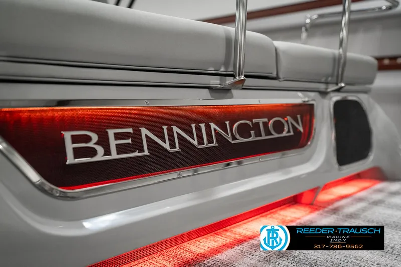 Slide: The Image of 2025 Bennington 23 RSB boat with illuminated branding and sleek design. - 49