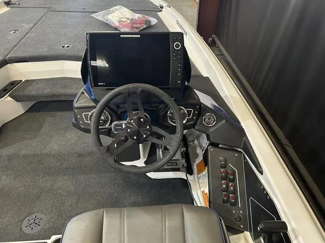 Slide: The Image of 2024 Skeeter ZXR 20 boat cockpit with steering wheel and control panel. - 11