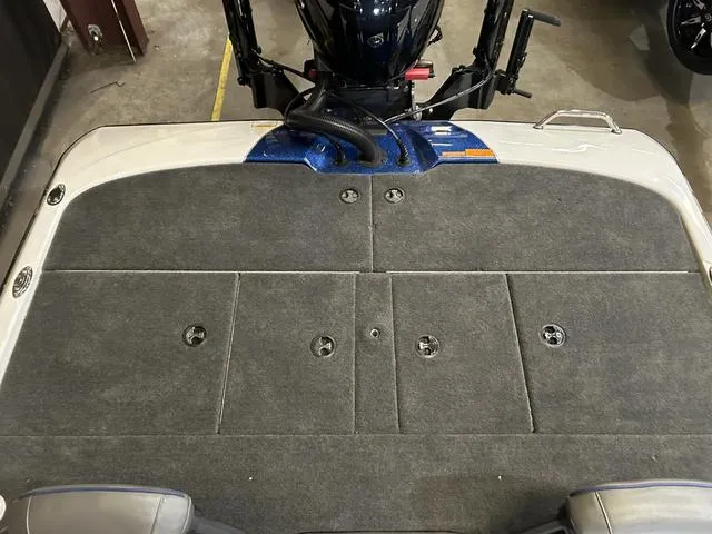 Slide: The Image of 2024 Skeeter ZXR 20 boat deck with Yamaha 250 SHO engine, gray carpeted surface. - 13