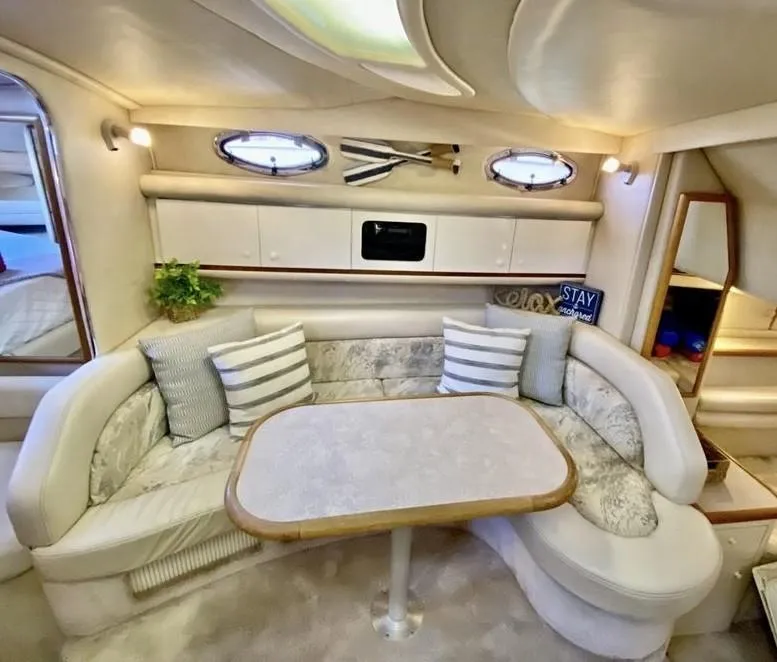 Slide: The Image of Luxurious 1996 Sea Ray 330 Sundancer cabin with elegant seating and decor. - 2