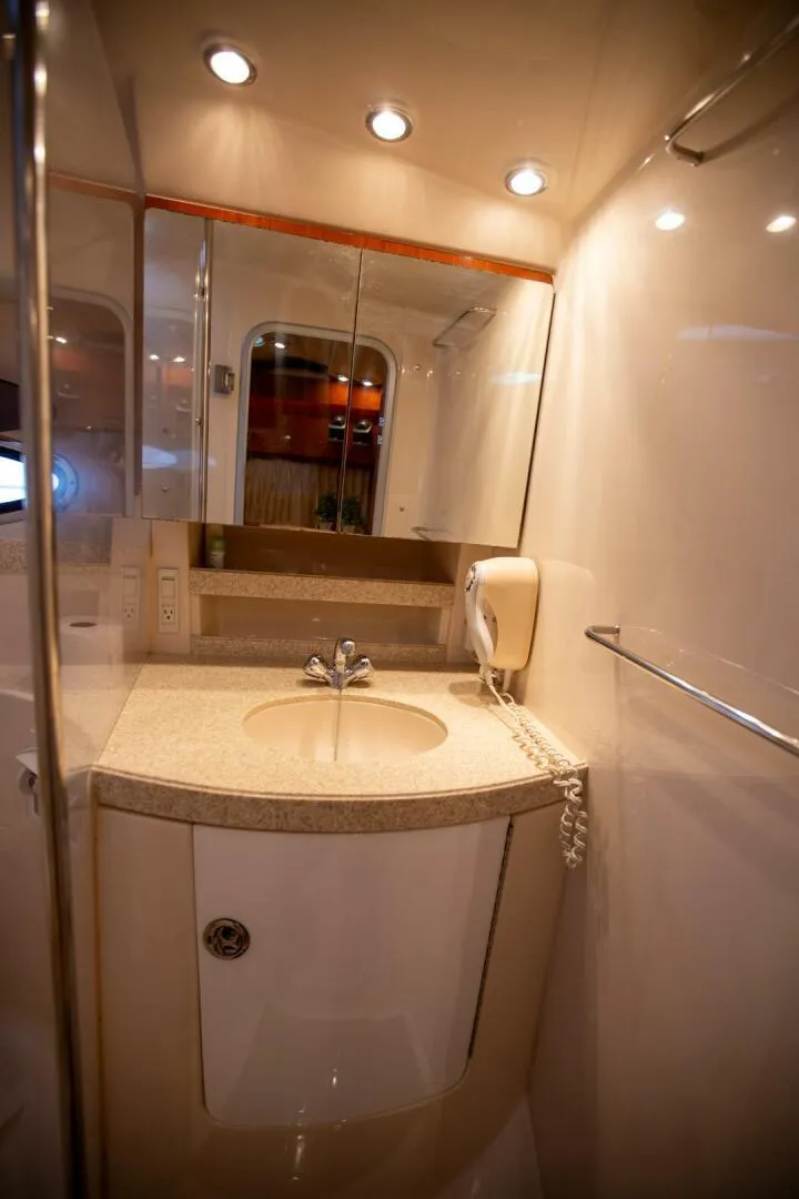 Slide: The Image of Luxurious bathroom in 2008 Regal 38 yacht with modern fixtures and lighting. - 24