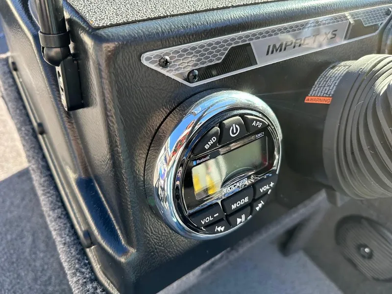Slide: The Image of Close-up of 2025 Lund 1775 Impact XS Sport boat dashboard controls. - 13