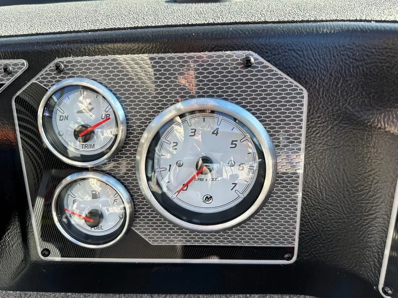 Slide: The Image of Dashboard gauges of 2025 Lund 1775 Impact XS Sport boat. - 15
