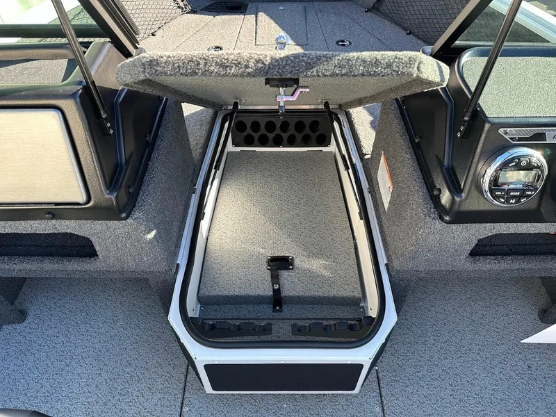 Slide: The Image of 2025 Lund 1775 Impact XS Sport boat interior with open storage compartment. - 29