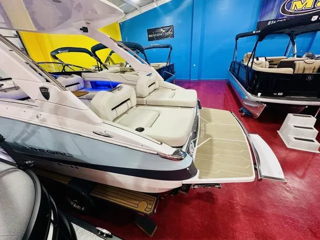Slide: The Image of 2025 Regal LS6 boat in showroom, featuring luxurious seating and sleek design. - 10