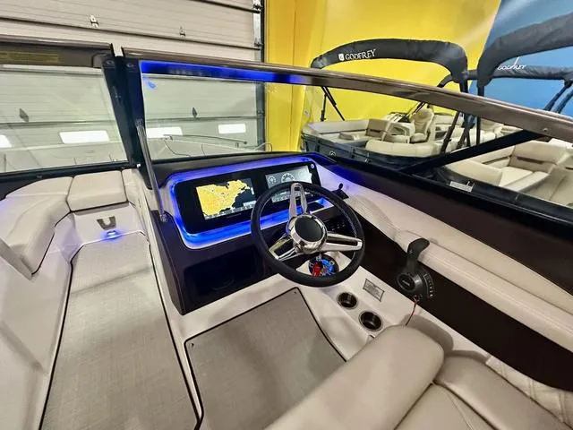 Slide: The Image of 2025 Regal LS6 boat interior with modern dashboard and steering wheel. - 20