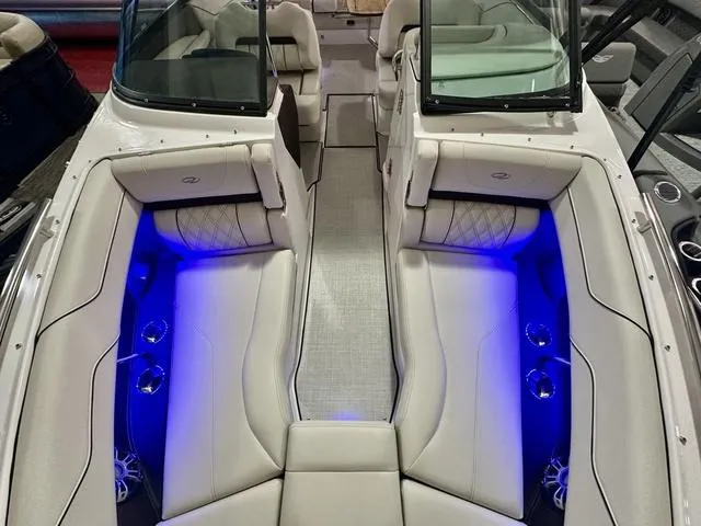 Slide: The Image of 2025 Regal LS6 boat interior with blue LED lighting and luxurious seating. - 26