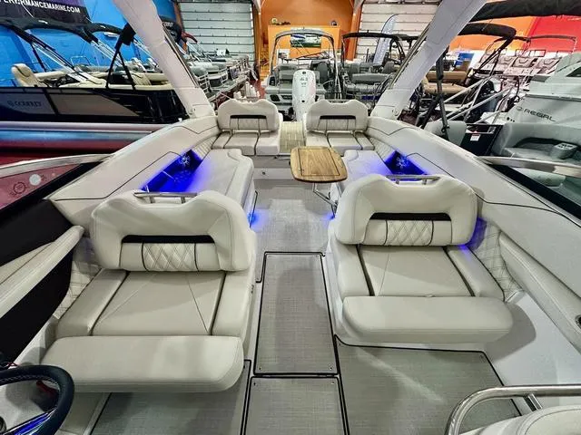 Slide: The Image of Luxurious 2025 Regal LS6 boat interior with plush seating and ambient lighting. - 27
