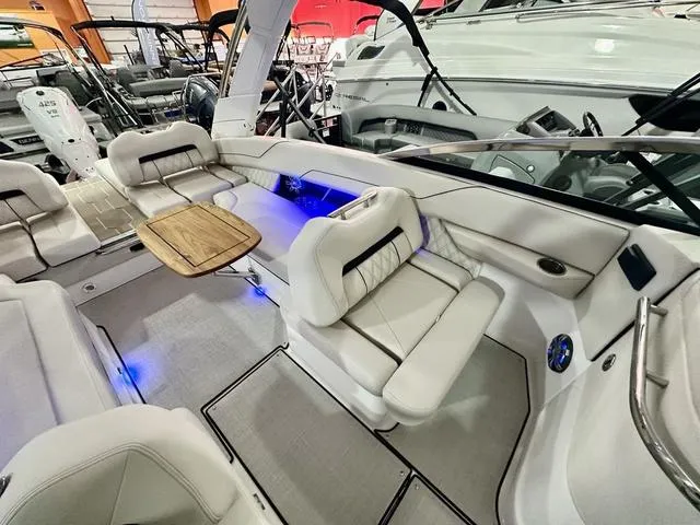 Slide: The Image of Luxurious 2025 Regal LS6 boat interior with plush seating and ambient lighting. - 29