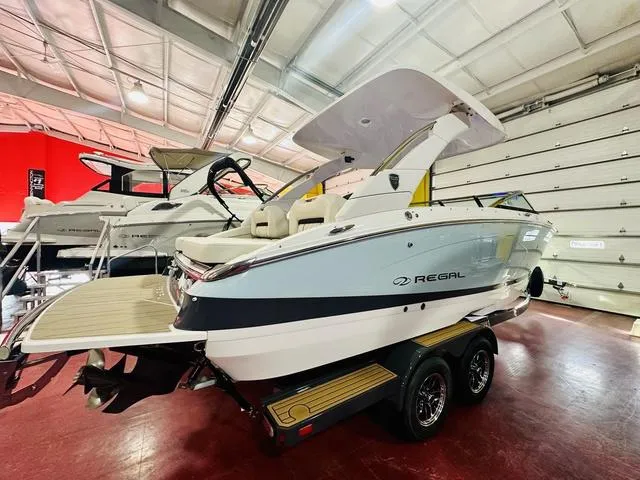 Slide: The Image of 2025 Regal LS6 boat in showroom, featuring sleek design and modern amenities. - 4