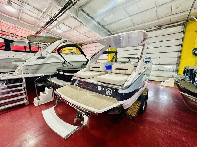 Slide: The Image of 2025 Regal LS6 boat in showroom, featuring sleek design and comfortable seating. - 5