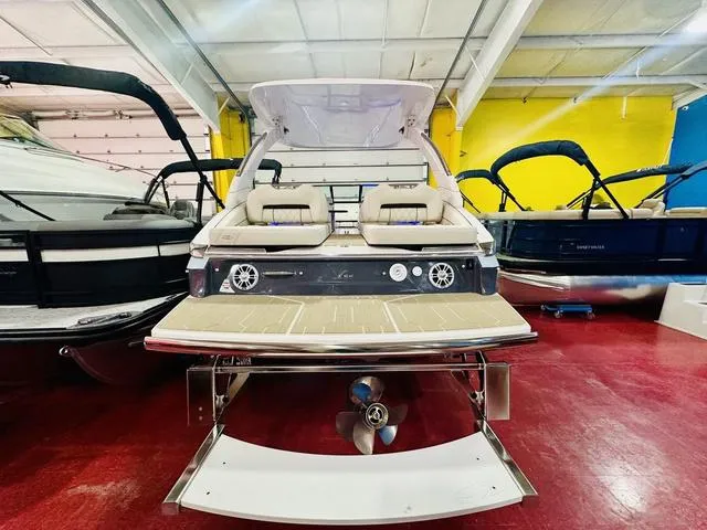 Slide: The Image of 2025 Regal LS6 boat in showroom, featuring sleek design and modern amenities. - 6