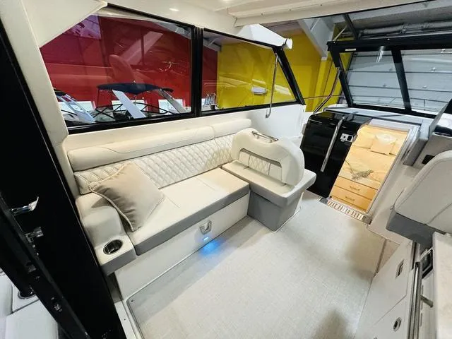 Slide: The Image of 2025 Regal 36 Grande Coupe interior with luxurious seating and modern design. - 11