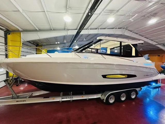 Slide: The Image of 2025 Regal 36 Grande Coupe boat on trailer in showroom. - 17