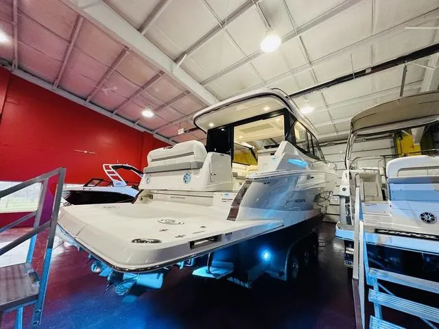 Slide: The Image of 2025 Regal 36 Grande Coupe yacht in a showroom, showcasing sleek design and modern features. - 18