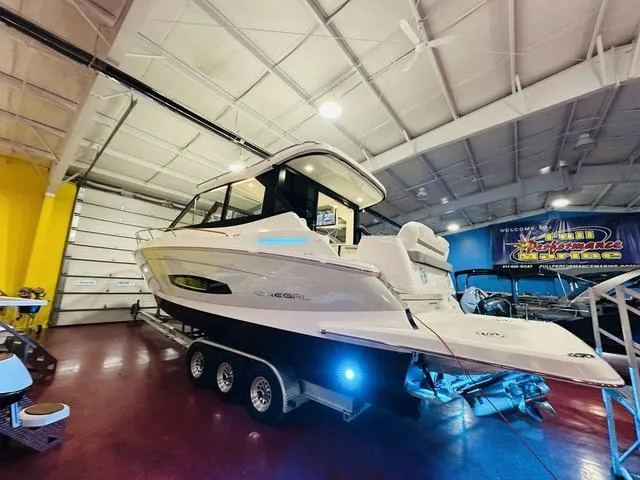Slide: The Image of 2025 Regal 36 Grande Coupe boat in showroom on trailer. - 20