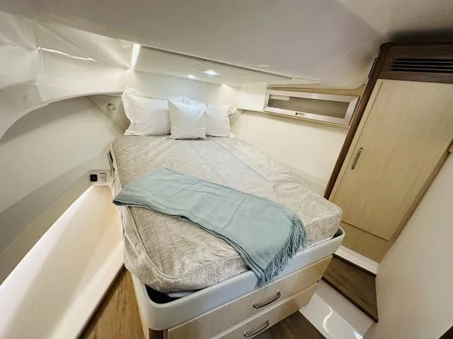 Slide: The Image of Luxurious cabin interior of 2025 Regal 36 Grande Coupe yacht. - 26