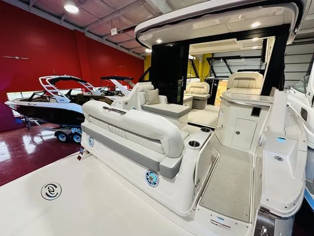 Slide: The Image of 2025 Regal 36 Grande Coupe luxury yacht interior with plush seating and modern design. - 3